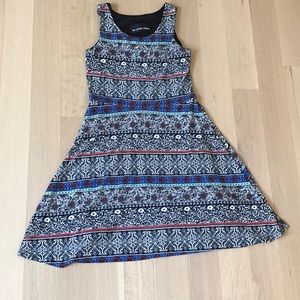 An Un Deux Trois dress size 7/8 black and white design with blue, red and green.